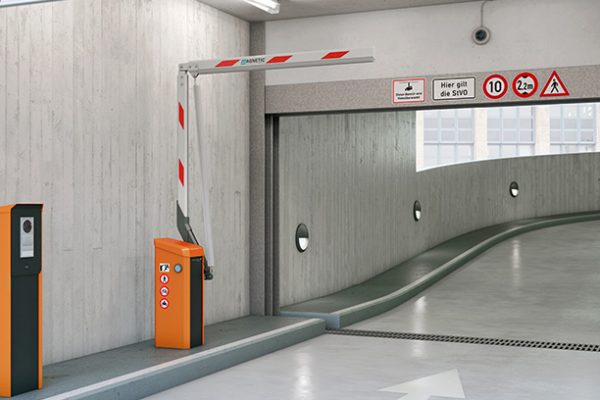 A commercial parking garage entrance featuring an orange automated barrier gate system with a red and white striped arm, an access control terminal, and regulatory signage mounted on the concrete wall above.